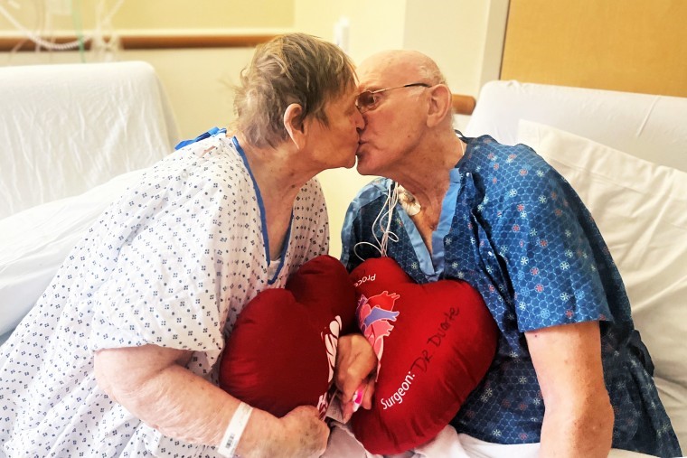 Margaret and Phil Vaske kiss in a hospital room.