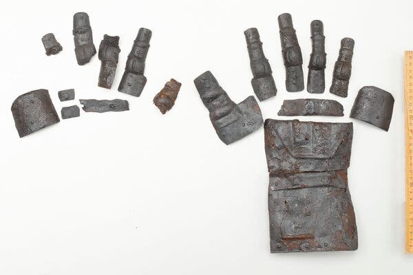 Pieces of a partial left gauntlet and a complete right gauntlet.